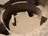 Looking into a cermonial kiva at the Long House ruinO